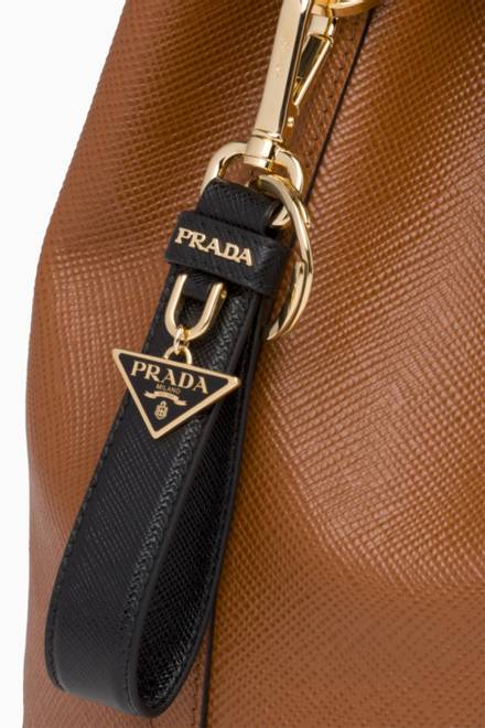 hover state of Triangle Logo Keychain in Saffiano Leather   